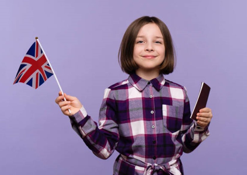 Child waving Union Flag